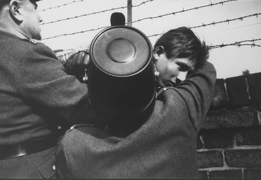 An East German teen escapes over the Berlin Wall to the West